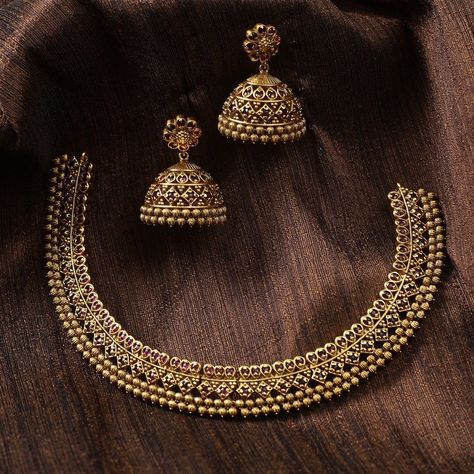 Description This antique necklace set by Tarinika is designed for someone who likes simple Indian jewelry. The necklace is crafted with geometric patterns and CZ stones on an antique gold-plated finish. It comes with traditional Jhumki style earrings which can be worn alone. Style this beautiful CZ patterned necklace set on your favorite ethnic outfit. Details & Specifications: Materials used: Brass Alloy with Antique Plating Weight – Necklace 43 gm, Earrings 25 gm Length – Necklace 12 cm, Earri Ethnic Outfits, Antique Necklace, Custom Necklace, Cz Stone, Jewelry Trends, Indian Jewelry, Antique Gold, Necklace Set, Beautiful Jewelry