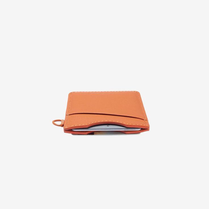 Our patented Vertical Wallet is a slim leather wallet equipped with our signature elastic pocket, which not only fits tightly around your cards but also gives the wallet a unique style. This Thread® wallet features RFID-secure technology to protect your credit card information. Cheap Orange Wallets For Everyday Use, Everyday Orange Leather Wallet, Cheap Orange Rectangular Wallets, Orange Leather Bifold Wallet, Orange Leather Wallet For Daily Use, Thread Wallets, Slim Leather Wallet, Leather Wallet, Credit Card