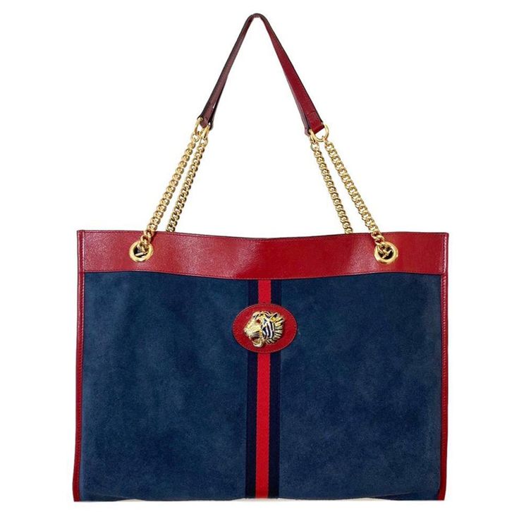 Gucci Suede Rajah Large Shopper Bag Dark blue suede tote bag trimmed in red leather. Enhanced by the blue and red Web inlaid onto the front. Bright red leather trim and shiny gold hardware. Stunning jewelled enamelled tiger head with crystals. Matching detachable purse Additional information: Size – 45 W x 10 D x 36 H cm Composition - Suede, Leather Condition – Very Good Comes with- Dust Bag, Matching Detachable Purse Large Shopper Bag, Suede Tote Bag, Red Web, Suede Tote, Bag Dark, Tiger Head, Shopper Bag, Blue Suede, Bright Red