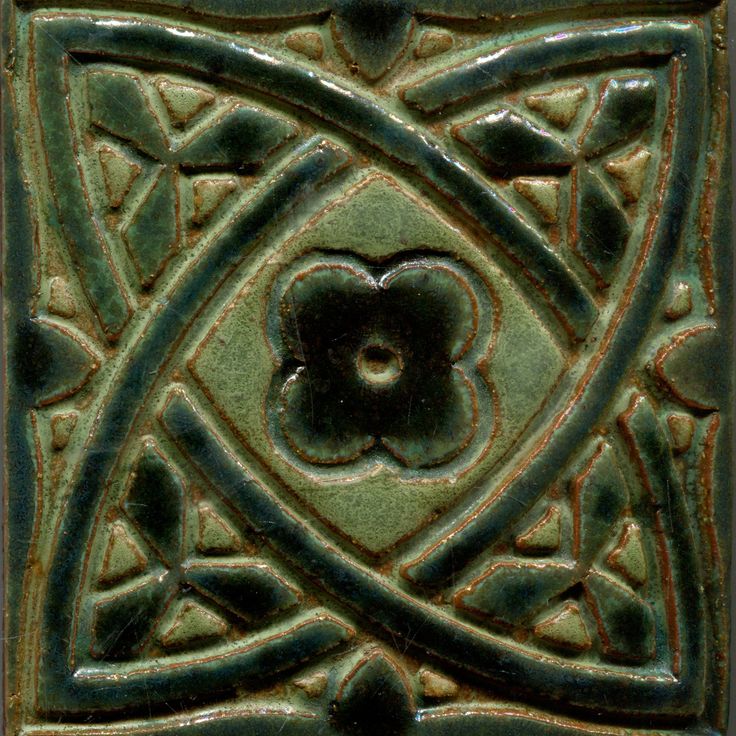 a decorative tile with an eye in the center