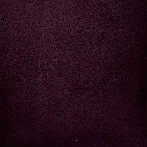 an image of a purple background that looks like it has been dyed with dark colors