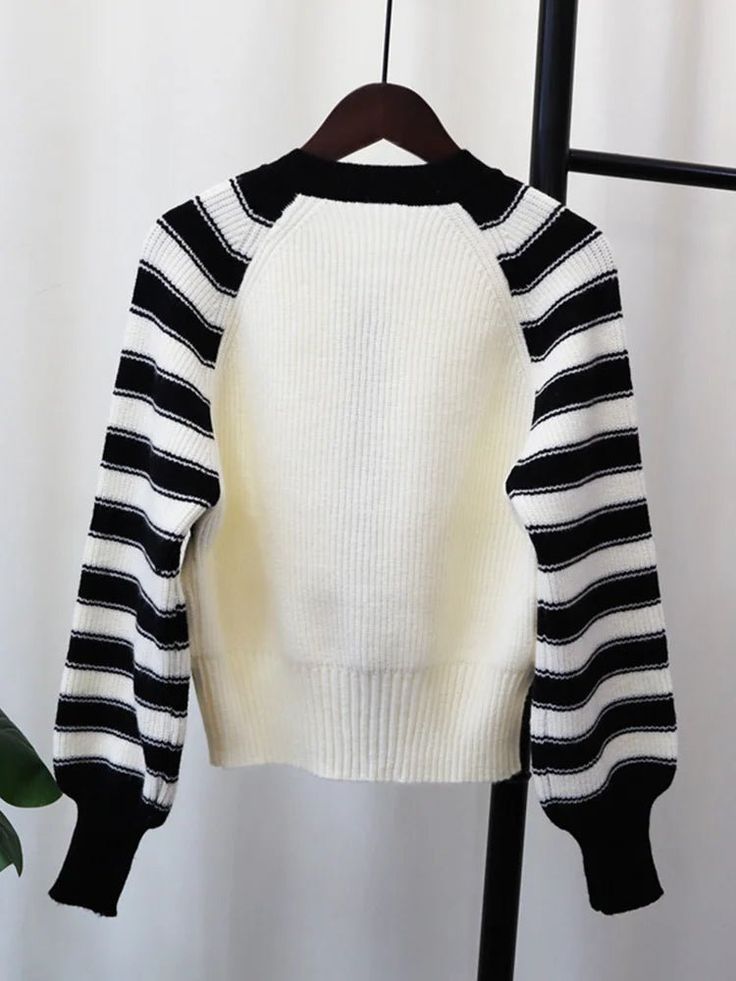 Fabric: Knit White Ribbed Knit Sweater, White Stretch Knit Sweater, White Chunky Knit Stretch Sweater, White Stretch Sweater With Chunky Knit, White Stretch Chunky Knit Sweater, Trendy White Ribbed Sweater, White Stretch Knitted Sweater, White Ribbed Sweater For Spring, Trendy White Soft Knit Sweater