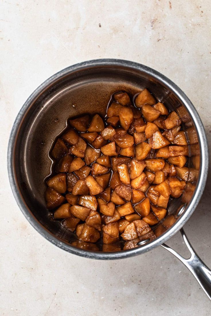 a pan filled with food sitting on top of a counter