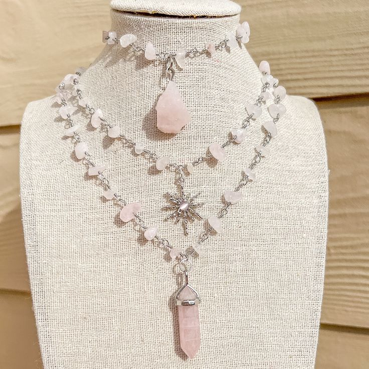 Silver Wire Wrapped Rose Quartz Necklace/Hippie Choker/Gemstone Jewelry/Crystal Necklace/Hippy Crystal Choker/Hippie/Boho/Gift for Her - Choker style crystal necklace with Rose Quartz Crystal Chip Beads and variety of charms - Length is 15",16", 17", 18" and 19"  - Materials: Silver plated copper wire, natural Rose Quartz crystals and, brass charms and stone charms Check other styles in my shop: https://www.etsy.com/listing/1495642204/carnelian-sun-charm-wire-wrapped-gold?click_key=767e5654fd339 Bohemian Crystal Jewelry With Jewels, Bohemian Crystal Necklace For Festivals, Bohemian Crystal Necklace For Gift, Bohemian Crystal Necklace For A Gift, Adjustable Crystal Necklace For Festivals, Bohemian Crystal Necklaces With Jewels For Gifts, Bohemian Adjustable Rose Quartz Jewelry, Adjustable Bohemian Rose Quartz Jewelry, Bohemian Crystal Jewelry With Gemstones