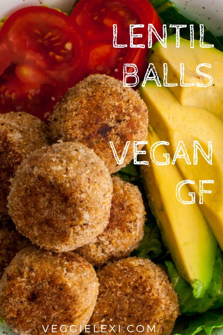 a bowl filled with lettuce, tomatoes and balls of vegan gf