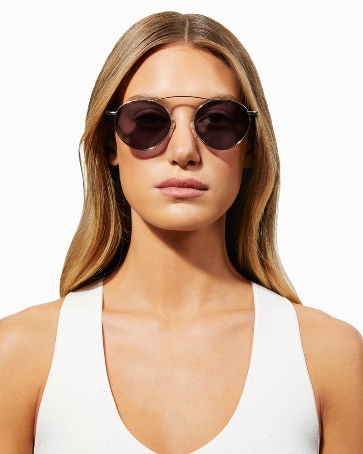 Up your backyard fabulous in the Tulum. Featuring a trendy oval frame and raised brow bar, these shades are a modern interpretation of a retro silhouette. The shiny gold frame is complemented by its solid smoke lens to enhance your look, wherever you go. Wear with our Bryce Top and Denim Shorts for a simple and sleek summer look. Also available in: Mirrored Pink Details Frame Material: Metal Frame Frame Color: Black Lenses: Solid Green with Pink 100% UVB protection Your sunglasses will arrive in Sleek Sunglasses With Uva Protection, Modern Aviator Sunglasses For Summer Travel, Sleek Everyday Sunglasses For Summer, Modern Aviator Sunglasses With Mirrored Lenses For Travel, Sleek Aviator Sunglasses With Uv Protection For Summer, Sleek Summer Aviator Sunglasses With Mirrored Lenses, Gold Aviator Sunglasses For The Beach, Sleek Summer Sunglasses With Metal Frame, Gold Modern Aviator Sunglasses For Beach