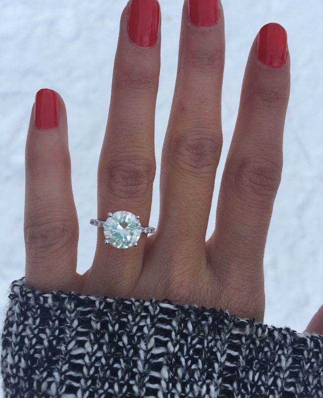 a woman's hand with a ring on it