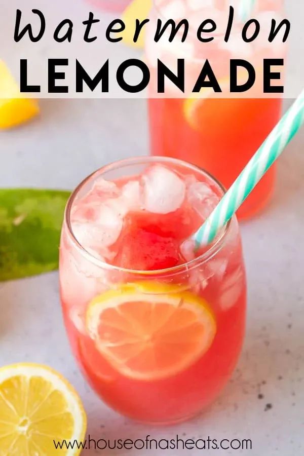 two glasses filled with watermelon lemonade on top of a table next to sliced lemons