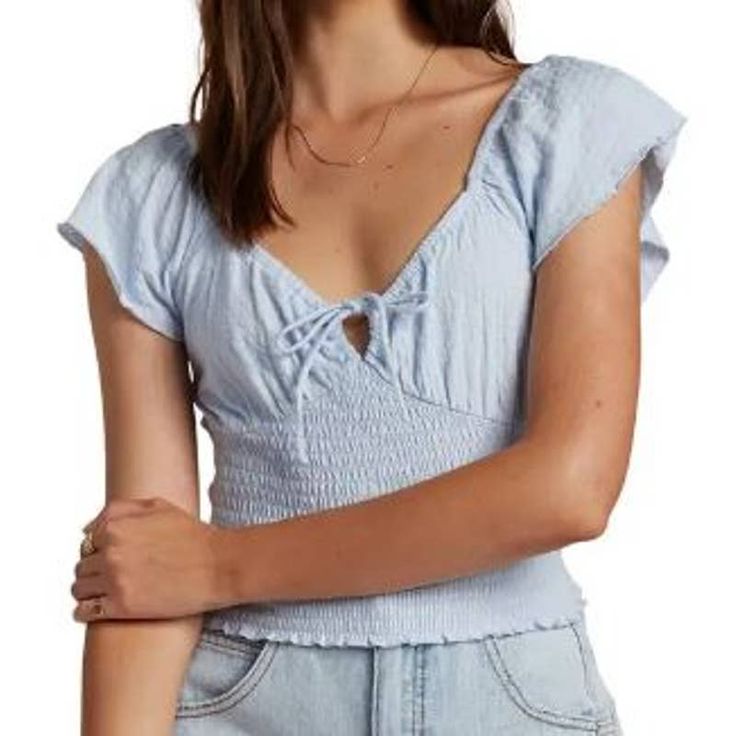 Nwt Billabong Secret Spot Smocked Ruffle Sleeve Top Shirt Size Large Blue This Charming Top With A Smocked Bodice Has Romantic Ruffles On The Short Sleeves And A Plunging Sweetheart Neckline With A Tie Closure At The Front. Measurements In The Photos. Excellent Condition, Smoke Free Environment, Ships Next Business Day! Ask Any Question! Bundle & Save! Light Blue Smocked Bodice Top For Summer, Blue Top With Smocked Bodice For Brunch, Blue Ruched Short Sleeve Top, Light Blue Smocked Back Top For Spring, Blue Cotton Smocked Top For Brunch, Blue Cotton Trendy Smocked Top, Trendy Blue Cotton Smocked Top, Light Blue Smocked Back Top For Summer, Casual Tops With Smocked Back For Brunch