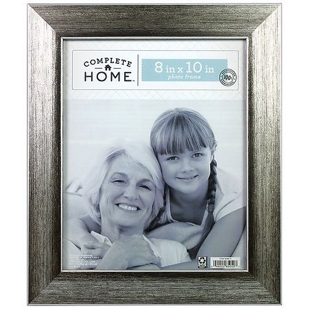 a silver frame with an image of two women hugging each other and the words complete home on it