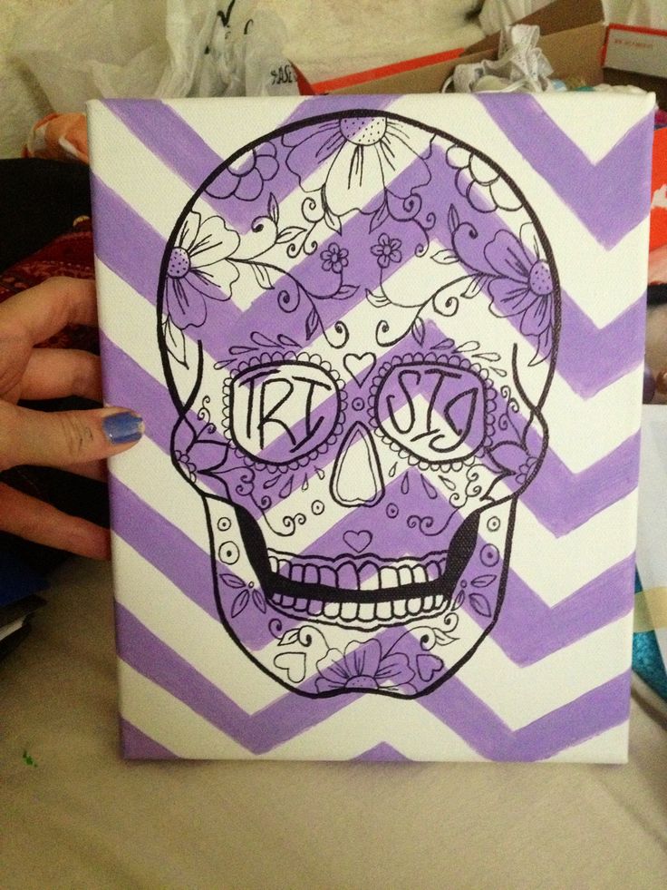 an image of a purple and white skull painted on canvas