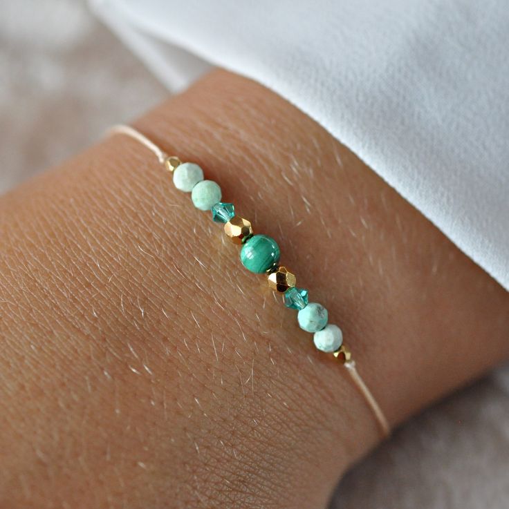 ✦ Gemstone Bracelet with malachite, Swarovski, 24k Gold Filled, Delicate adjustable bracelet, Minimalist Bracelet, Everyday Bracelet ✦ This bracelet made of beige jewelry string and natural stones with a size of 2mm to 4mm. ✔ 100% natural malachite (not synthetic) ✔ Peruvian turquoise ✔ Swarovski bicone crystals ✔ Czech beads covered with 24k gold ✦ The bracelet is adjustable thanks to the macrame weaving technique, it is comfortable to put on.  The nylon string makes the bracelet very durable ✦ Your bracelet will be packed in a hand made envelope with a brand logo, making it perfect for gifting  ✦ If you want to give jewelry to a loved one and leave a message for them, give me its content in the message when buying  ✦ Perfect bracelet: ✦ * for myself :) * as a gift for mom/sister/friend * Elegant Adjustable Green Friendship Bracelets, Handmade Adjustable Beaded Bracelets For May Birthstone, Gold Gemstone Beads Friendship Bracelets For Gift, Gold Friendship Bracelets With Gemstone Beads As A Gift, Gold Friendship Bracelets With Gemstone Beads, Gold Friendship Bracelets With Natural Stones As Gift, Adjustable Minimalist Beaded Bracelets For May Birthstone, Elegant Malachite Beaded Bracelets For Gift, Delicate Green Bracelet Jewelry