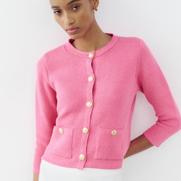 Round Neck Long Sleeve Cardigan. Front Patch Pockets. Front Gold Button Closure. Pink | 6427/054 Outer Shell 66% Cotton 34% Polyester Chic Knit Cardigan With Buttons, Spring Button-up Sweater With Button Cuffs, Spring Button-up Sweater With Buttoned Pockets, Elegant Pink Sweater With Button Closure, Spring Sweater With Buttoned Pockets And Long Sleeves, Chic Spring Cardigan With Buttons, Chic Button-up Sweater With Button Cuffs, Chic Button-up Spring Sweater, Chic Button-up Sweater For Spring