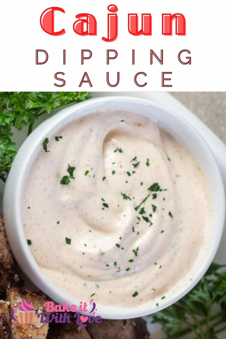 a white plate topped with grilled steaks and ranch dip in a small bowl