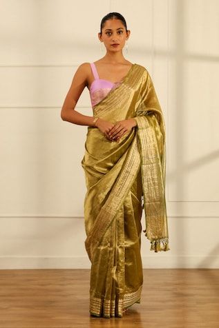 Olive green handwoven tissue silk saree with a floral pattern border. Comes with an unstitched blouse piece. - Aza Fashions Pista Green Cotton Silk Pre-draped Saree, Festive Pista Green Handloom Pre-draped Saree, Gold Tissue Silk Blouse With Dupatta, Gold Silk Pre-draped Saree For Eid, Gold Cotton Silk Blouse With Dupatta, Pista Green Silk Pre-draped Saree For Navratri, Unstitched Tissue Silk Blouse Piece In Pista Green, Pista Green Cotton Silk Pre-draped Saree With Pallu, Designer Gold Slub Silk Blouse Piece