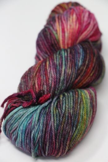 a skein of multicolored yarn on a white surface