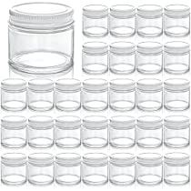 a set of glass jars with lids on the top and bottom, all lined up in rows