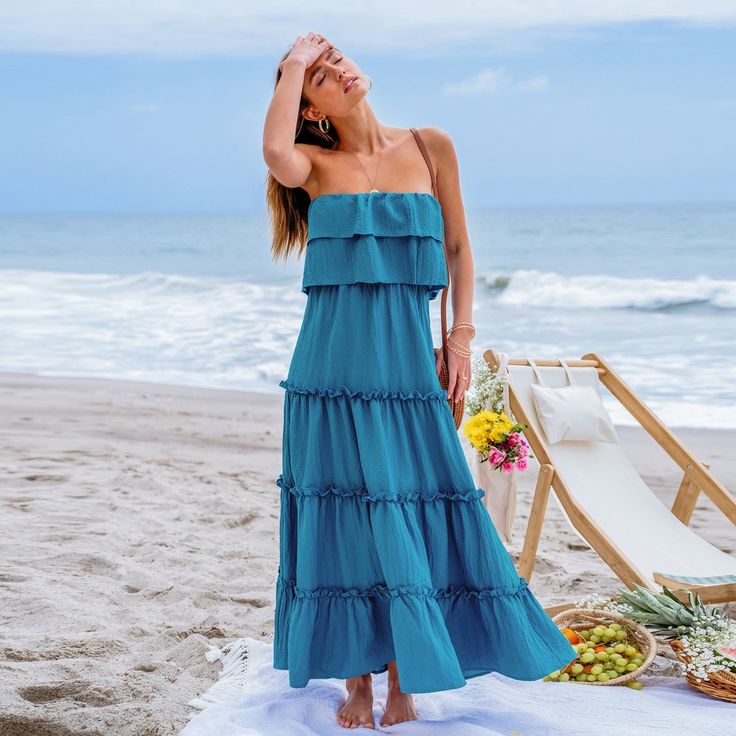 Dance into summer with our Ruffled Tiered Maxi Tube Dress! Featuring cascading tiers of playful ruffles, this dress exudes holiday charm and carefree elegance, perfect for twirling through sunny days and warm nights with style and grace. Whether you're lounging by the pool, exploring a new destination, or attending a casual outdoor event, this versatile piece will keep you looking effortlessly chic and feeling comfortable all day long. Product code: CAA05A4E054TT Summer Tiered Beach Dress, Tiered Maxi Dress For Summer Vacation, Sleeveless Ruffled Sundress For Beach Party, Flowy Ruffled Tiered Dress For Day Out, Tiered Maxi Dress For The Beach, Flowy Tiered Dress With Ruffles For Day Out, Flowy Tiered Maxi Dress For Vacation, Beach Season Dress With Ruffled Straps And Details, Summer Tiered Sundress Maxi Dress