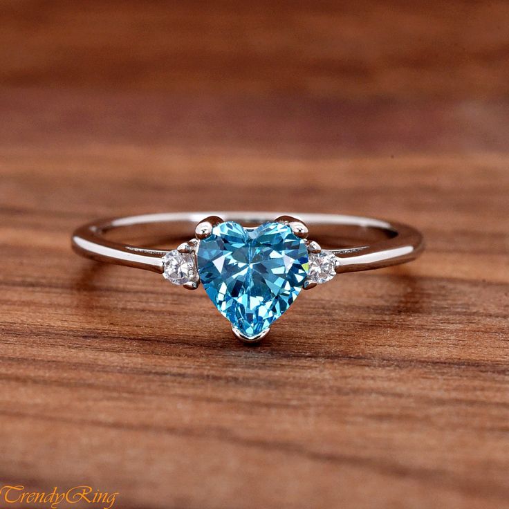 Heart Light Blue Cubic Zirconia Sterling Silver Ring, Simulated March Birthstone Aquamarine Color CZ Sterling Silver Girls Teens Womens Ring ▷Gift Box Included ▷7mm Height ▷Size 3 - 12 Available ▷925 Sterling Silver (not plated or filled) ▷925 Stamp Authenticity ▷High-Quality Cubic Zirconia Used https://www.etsy.com/shop/TrendyRing Aquamarine Color, Aquamarine Colour, Heart Lights, Womens Ring, March Birthstone, March Birth Stone, Ring Gift, Sterling Silver Ring, Aquamarine