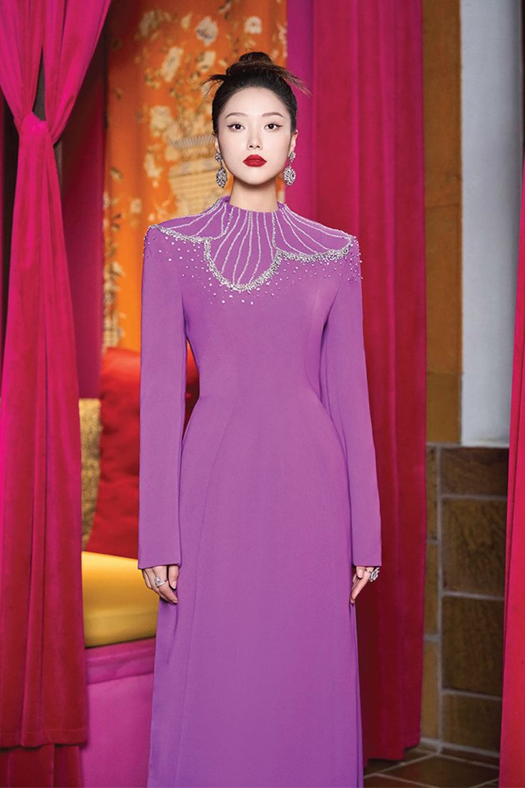 Elevate your wardrobe with the dress. Made with luxurious velvet and satin, this dress exudes elegance and sophistication. The high neck design adds a touch of refinement while the sheath silhouette flatters your figure. Perfect for a special occasion, this dress is a timeless addition to any wardrobe. * Note: The photo of the dress product is sketched based on the ao dai product and is for reference only. Dress products will not have slits on either side. Eid Suits, Corporate Woman, Suits Ideas, Corporate Women, Mean Blvd, Fashion Top Outfits, High Neck Designs, Floor Length Dress, Dresses Xxl