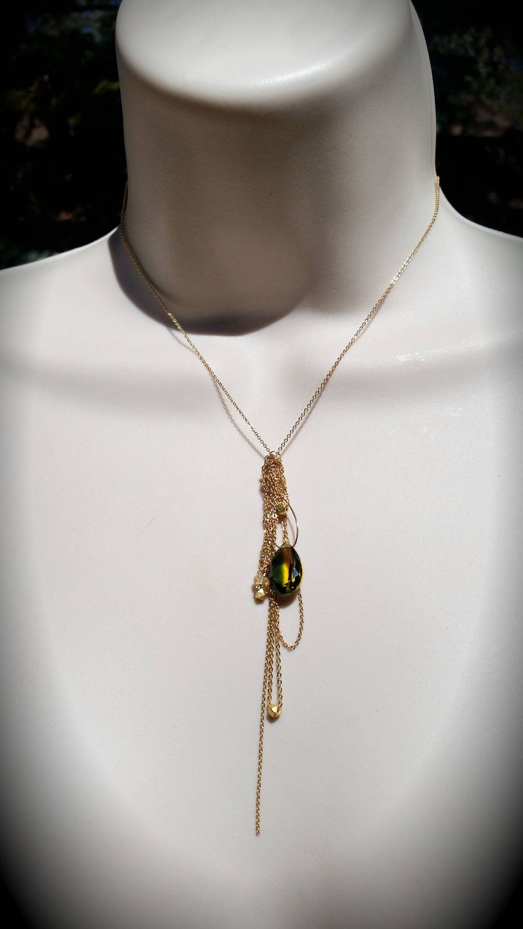 "I designed this necklace for Stassi based on the color and shape of the stone. Stassi loves the green and yellow colors in the quartz teardrop stone (12mm X 14mm). She wanted me to create a necklace based off her \"Boho\" style. This necklace can be made in sterling silver or 14k gold fill flat cable chain. The chains fall like a \"messy\" tassel, all different lengths. There are several citrine stones and 22k gold plated nuggets that are at the bottom of some of the chains. There are several s Green Teardrop Jewelry With Adjustable Chain, Green Teardrop Necklace With Adjustable Chain, Green Teardrop Pendant Drop Necklace For Gift, Green Teardrop Pendant Drop Necklace As Gift, Green Drop Necklace For May Birthstone, Green Teardrop Necklace For May Birthstone, Green Drop Necklace With Adjustable Chain As Gift, Green Drop-shape Birthstone Necklace, Green Teardrop Pendant Necklace With Birthstone