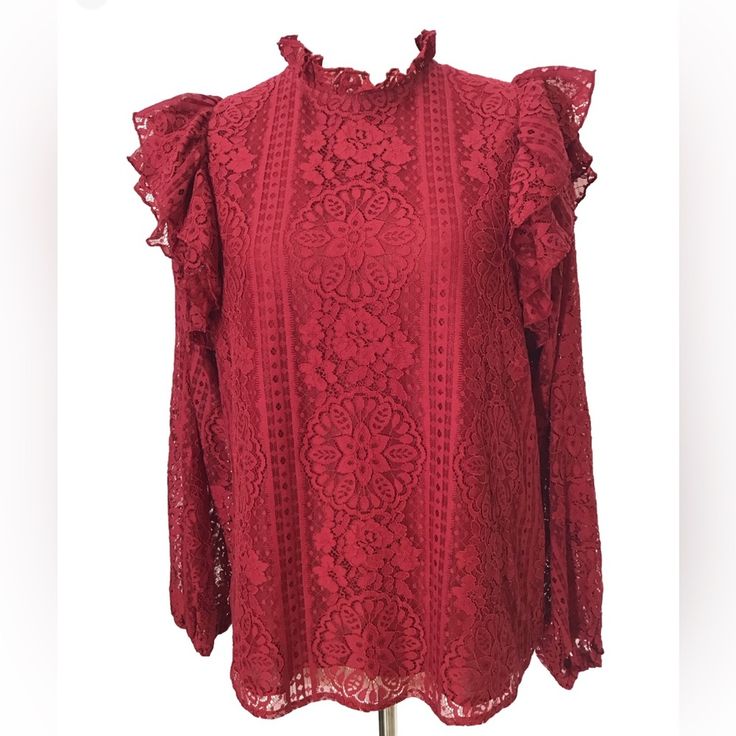 This Beautiful Entro Blouse In Cranberry Salsa Color Is A Must-Have Addition To Your Wardrobe. The High Neck And Button Closure Make It Perfect For Any Occasion, Whether It's A Party, Work, Or Casual Wear. The Lace Fabric With Ruffle Details Adds A Touch Of Elegance To The Blouse. The Blouse Is Available In Size Small And Is Suitable For Women Who Love Colorful Themes. Semi Sheer Sleeves With Elastic Cuffs Keyhole Neckline Lined Length: 25” Pit To Pit: 20” New With Tags (29) Elegant Red Ruffled Blouse, Elegant Ruffled Lace Top For Brunch, Red Ruffled Feminine Tops, Red Feminine Ruffled Tops, Red Ruffled Blouse For Fall, Red Feminine Ruffle Top, Feminine Red Ruffled Tops, Red Lace Tops For Spring, Red Ruffled Tops For Brunch