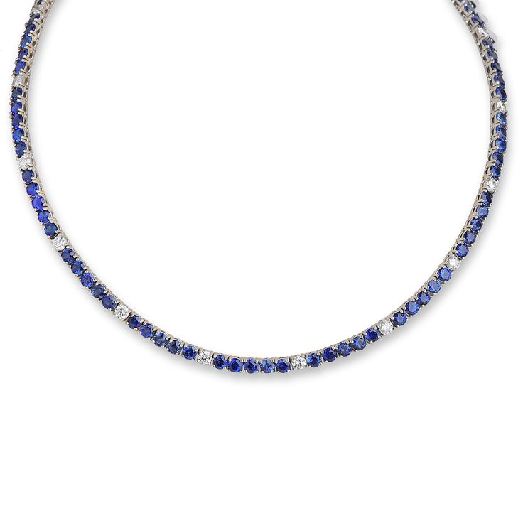 18kt White Gold Sapphire and Diamond Tennis Necklace: 19cts of round blue sapphire 3cts of round diamonds Length: 16" Classic Blue Diamond Necklace With 17 Jewels, Classic Blue Diamond Necklace With Diamond Cut, Luxury Round Gemstone Tennis Necklace, Classic Blue Diamond Cut Diamond Necklace, Blue Sapphire Jewelry With Single-cut Diamonds, Blue Sapphire Jewelry With Single Cut Diamonds, Classic Blue Diamond Cut Necklace, Round Gemstone Tennis Necklace Fine Jewelry, Luxury Round Sapphire Diamond Necklace