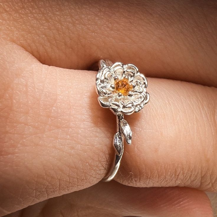 "Title: Chrysanthemum November Birth Month Flower Ring with Citrine Birthstone Material: Material:  Solid 14k Yellow Gold, 14k White Gold, 14k Rose Gold or solid 925 Sterling Silver.  18k and 9k Gold are available upon request. Timeline: Custom made to order (2 weeks) Size:  Stone: 2 mm genuine AA grade brilliant cut and 1.2-3 solid round band Special Options: I offer different gemstones upon request  Story: Chrysanthemum represents a long and joyful life, while its beautiful blooms symbolize au Dainty Gemstone Flower Ring, Fine Jewelry Flower Ring With Birthstone In Sterling Silver, Fine Jewelry Sterling Silver Flower Ring With Birthstone, White Gold Jewelry With Gemstone In Flower Shape, White Gold Flower Ring With Birthstone, Flower Shaped Gemstone Ring For Anniversary, Gemstone Flower Ring For Anniversary, Dainty Flower Jewelry With Prong Setting, Fine Jewelry Flower Ring With Prong Setting