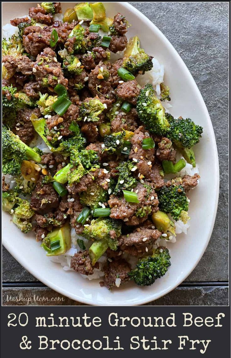 a white plate topped with meat and broccoli covered in seasoning next to rice