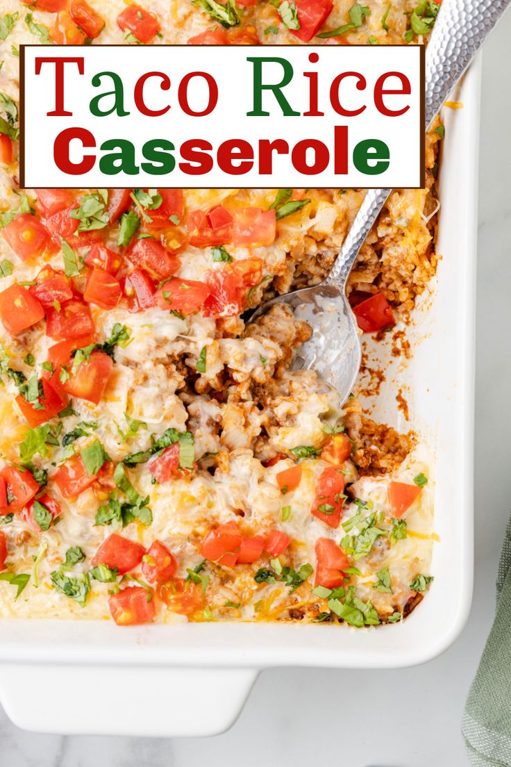 taco rice casserole in a white dish with a spoon