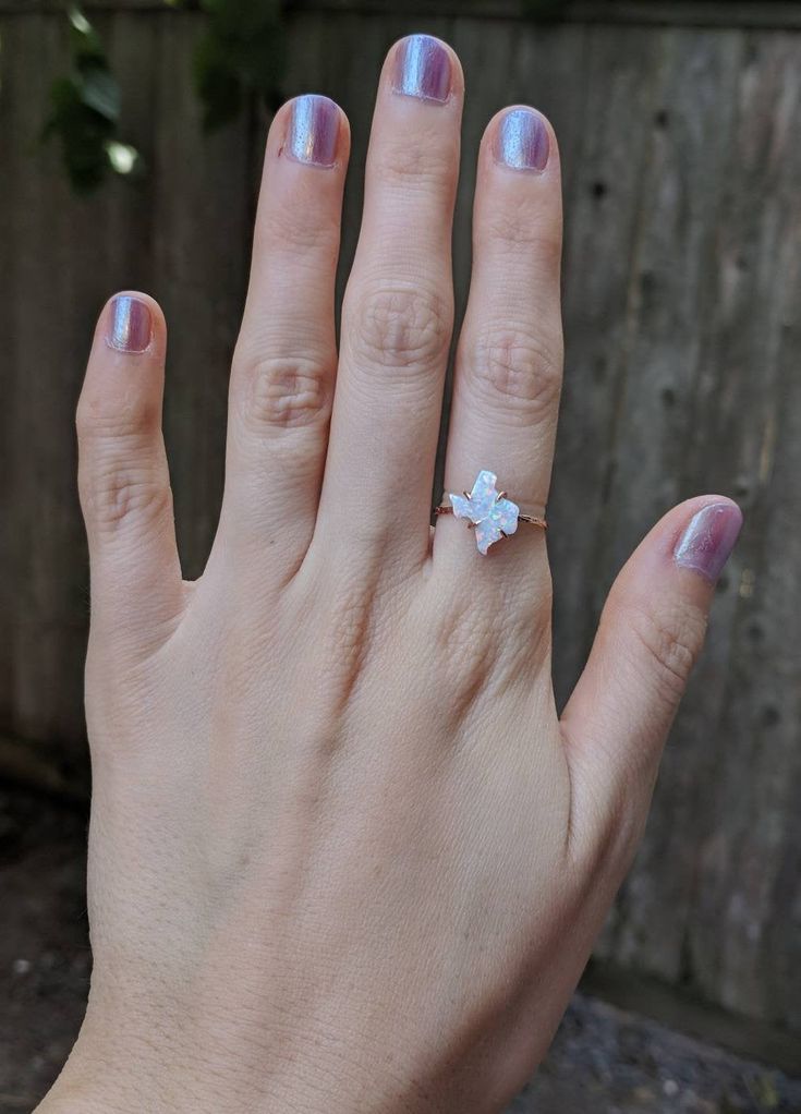 -------------------------------------------------------- THE PRODUCT This listing is for our gorgeous opal Texas shape ring. We completely hand make these ourselves from a white fire opal that is predominately white but has gorgeous flashes of reds and blues. Pictured here I have the ring shown in several different light levels to see how the colors of the stone changes in brighter and darker light. Each piece is completely unique and will have it's own color variations, but all are very bright Minimalist White Opal Open Ring, Adjustable White Opal Open Ring, White Opal Dainty Birthstone Ring, White Dainty Opal Birthstone Ring, White Opal Crystal Ring For Gift, Adjustable Opal Ring, White Opal Open Ring, White Opal Crystal Promise Ring, White Opal Birthstone Promise Ring