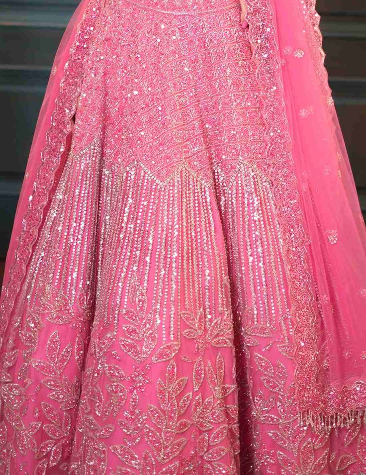 Dreamy pink lehenga with a flowing jaal, mixing floral and geometric embroidery. The outfit has a dramatic trail,embroidered strappy blouse and matching embellished dupatta with sequin crystal and cutdana embroidery.From Isa by Dolly Wahal's Fiori collection.DELIVERY TIMEPlease allow 8-12 weeks for your outfit to arrive.FABRIC DETAILSNetProfessional cleaning only. Bollywood Style Hand Embellished Georgette Choli, Bollywood Style Hand-embellished Georgette Choli, Hand Embellished Chinon Lehenga Floor-length, Hand Embellished Floor-length Chinon Lehenga, Hand Embellished Traditional Drape Choli For Diwali, Festive Hand Embellished Designer Lehenga, Navratri Hand Embellished Dupatta, Pink Dola Silk Dress With Dabka Work, Semi-stitched Hand Embellished Chinon Lehenga