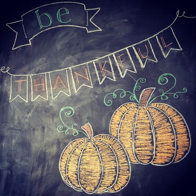 a chalk drawing of two pumpkins on a blackboard with the words thank you