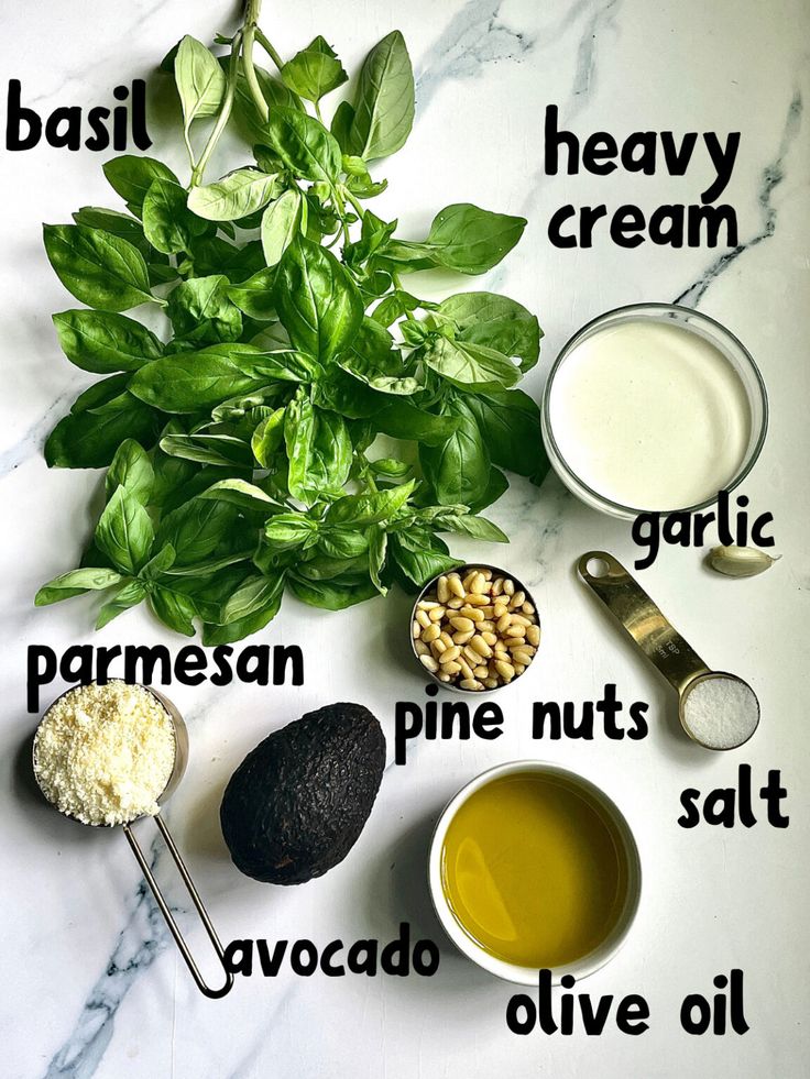 the ingredients to make basil ice cream on a marble countertop