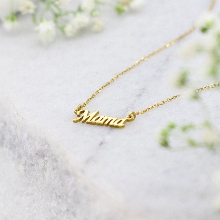 Gold Mama Necklace,Mama Necklace in 9K 14K and 18K Gold,Initial Mama Necklace,Mother's Day Gift A Gold Necklace made with love for all the wonderful mothers. This dainty necklace will be her favorite piece of jewelry, we promise! Hey Mama! ♡ Has anyone told you that you're doing an awesome job? ›› Item Details: › Made to Order › Gold Kt: 14K (also available in 9K & 18K) › Available Gold Color: White Gold, Yellow Gold, Rose Gold › Size of Pendant: 13MM x 4MM › Chain Type: Rolo › Chain Thick: Dainty Custom Name Charm Necklace For Mom, Dainty Name Charm Necklace As Gift, Personalized Delicate Name Necklace For Mother's Day, Delicate Personalized Name Necklace For Mother's Day, Mother's Day Personalized Delicate Name Necklace, Dainty 14k Gold Name Necklace For Mom, Dainty Nameplate Necklace As Gift For Mom, Dainty Nameplate Necklace For Mom, Gold Name Charm Necklace As Gift For Mom