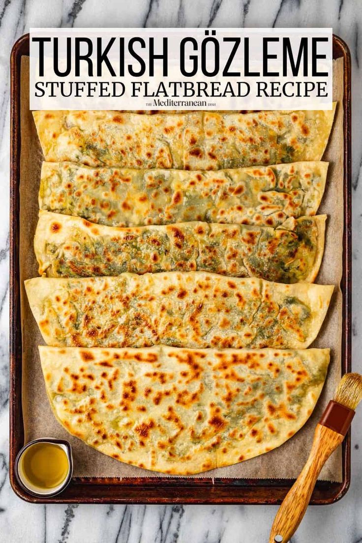 an overhead view of some flatbreads on a tray