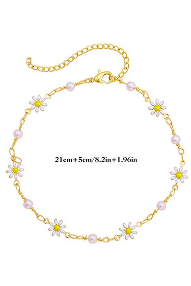 Enhance your summer look with this elegant Gold Daisy & Pearl Chain Anklet. Delicate gold chain with dainty daisies and lustrous pearls brings a touch of nature to your ankle. Perfect for strolling on the beach or dressing up for a special occasion. Elevate your style with this charming anklet. Urban Jewelry, Ruffle Wedding Dress, Skirts Jeans, Sunglass Chain, Gold Alloys, Daisy Chain, Chain Anklet, Pearl Chain, Gold Details