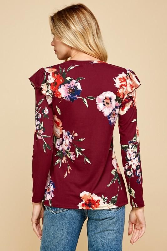 Burgundy top with a gorgeous floral print with ruffle sleeve accents. 87% Polyester 13% Spandex Spring Fitted Ruffle Top, Feminine Fitted Top With Ruffles, Fitted Tops With Ruffle Hem And Ruffle Sleeve, Floral Print Flutter Sleeve Tops For Brunch, Floral Print Top With Ruffle Sleeves For Brunch, Flutter Sleeve Floral Print Top For Brunch, Ruffle Sleeve Printed Top For Brunch, Feminine Floral Print Stretch Tops, Stretch Floral Print Blouse For Brunch