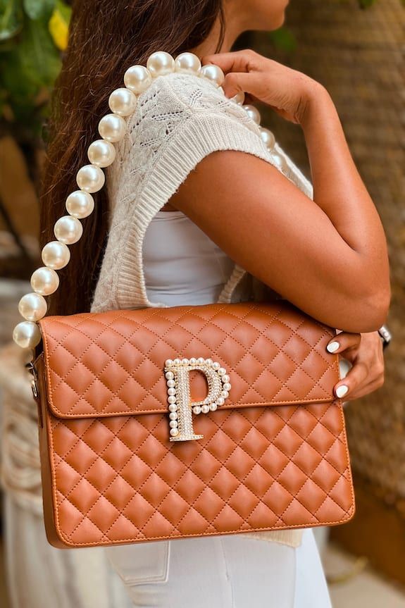 Tan geometric quilted bag with custom initial embellished with Swarovski and pearls and detachable pearl strap. - Aza Fashions Luxury Crossbody Shoulder Bag With Pearl Handle, Luxury Shoulder Bag With Pearl Handle, Luxury Tote Shoulder Bag With Pearl Handle, Luxury Clutch Shoulder Bag With Pearl Handle, Luxury Pearl Handle Shoulder Bag, Luxury Pearl Embellished Clutch Bag, Luxury Tote Bag With Pearl Handle, Luxury Shoulder Bag With Pearl Handle For Everyday, Luxury Pearl Embellished Clutch Shoulder Bag