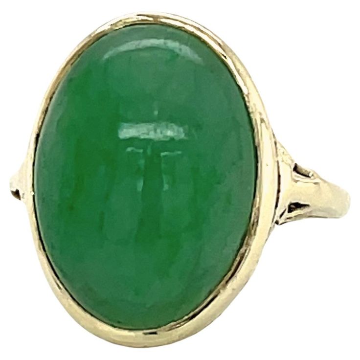 The simplicity of the design gives this mid century estate find a romantic feel. With its pleasing soft green hue the 11x15mm jadeite oval cabochon commands attention and is the feature of this lovely vintage ring. Made of 14 karat yellow gold, the filigree galley artfully displays the beauty of the the eight carat domed polished jadeite stone. In its original condition, the ring is in size 4 1/2 and can be resized. Gift wrapped. Yellow Gold Cocktail Ring, Vintage Cocktail Ring, Yellow Gold Solitaire, Marquise Ring, Gold Cocktail Ring, Peridot Stone, Gold Cocktail, Jade Stone, Diamond Cluster