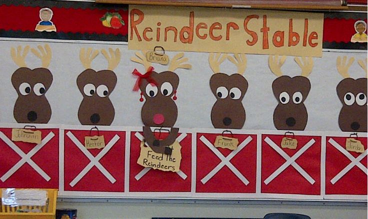 a bulletin board with reindeers on it in the middle of a classroom room at school