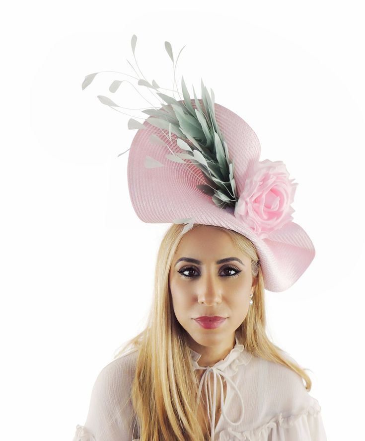 Hats By Cressida Kentucky Derby & Ascot Fascinator Hats Elsje Kentucky Derby Fascinator Candy Pink Free form base trimmed with a large spray of fuchsia pink feathers and a pink silk rose Base measures 14 inches wide Mounted with a matching headband. If you prefer a headband to match your hair, please make a note at check out what colour headband you want. This Fascinator is perfect for any special occasion like a wedding, bridal shower or ladies day at the races such as Royal Ascot, Kentucky Derby, Kentucky Oaks, and Melbourne Cup. We make each hat to order just for you, we would prefer if you did not order for choice. If colour match is important to you please ask for free fabric swatch to be sent to you - this reduces returns and disappointment.   We can also make a custom design for you Whimsical Pink Summer Hat, Pink Feminine Fascinator For Wedding, Pink Adjustable Costume Hat, Blush Fascinator For Kentucky Derby, Pink Straw Hat For Summer Parties, Pink Summer Party Straw Hat, Elegant Pink Beach Hat, Pink Feminine Fascinator For Kentucky Derby, Pink Kentucky Derby Fascinator With Handmade Flowers