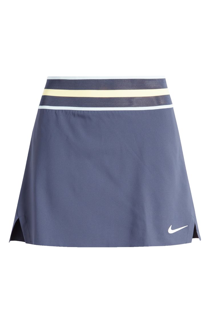 Elevate your game in this stretchy tennis skirt made of lightweight, sweat-wicking fabric that keeps you covered but cool. Also, built-in shorts with drop-in pockets keep you comfortable and your essentials close at hand. 14 1/2" center front length; 4" inseam; 17" leg opening (size Medium). Mesh elastic waist Built-in shorts with drop-in pockets Dri-FIT moisture-wicking technology Partially lined Skirt is 88% polyester, 12% spandex; shorts are 79% polyester, 21% spandex Machine wash, tumble dry Blue Tennis Bottoms With Built-in Shorts, Nike Sporty Short Skort, Sporty Blue Skort With Built-in Shorts, Athleisure Tennis Mini Skirt With Built-in Shorts, Blue Stretch Tennis Dress, Sporty Blue Tennis Skirt, Nike Stretch Short Skort, Blue Tennis Skort For Spring, Blue Stretch Tennis Skirt