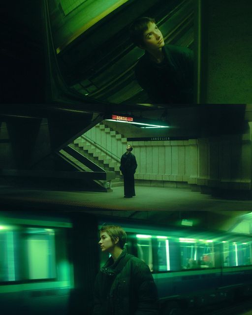 two people standing next to each other in a subway station