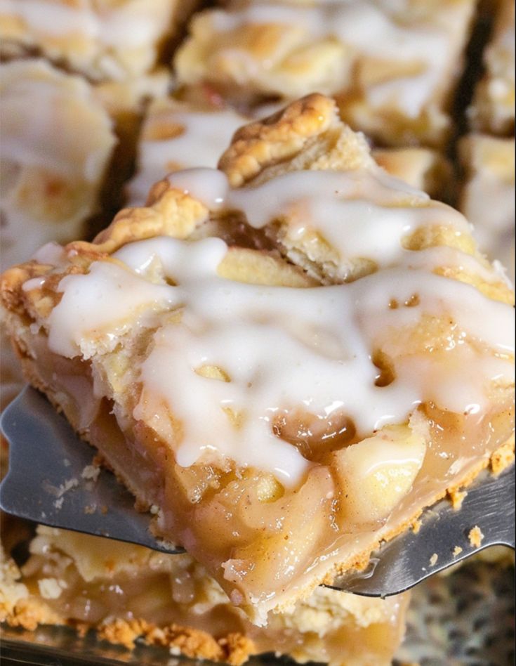 a close up of a piece of food with icing on it