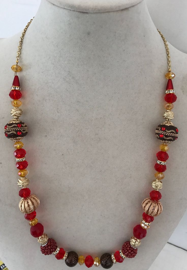 New handcrafted necklaces with red and gold beads will bring pizazz to your Christmas wardrobe. The red beads are different sizes, round most being different shades of red.  There also gold colored beads, and separators that have clear crystals in them.  The beads are strung from a gold-plated chain that fastens with a spring ring clasp. Crafting items for Christmas is something I enjoy doing.  Please let me know if you want this as a gift and I will put it in a special box. Handmade Red Beaded Necklaces For Celebration, Red Round Bead Necklaces For Party, Gold Round Beads Jewelry For Christmas, Elegant Red Beaded Necklaces For Festivals, Elegant Red Beaded Festival Necklaces, Elegant Red Beaded Necklace For Festivals, Festive Gold Beaded Necklaces With Spacer Beads, Elegant Red Beaded Necklace For Christmas, Handmade Red Beads For Christmas