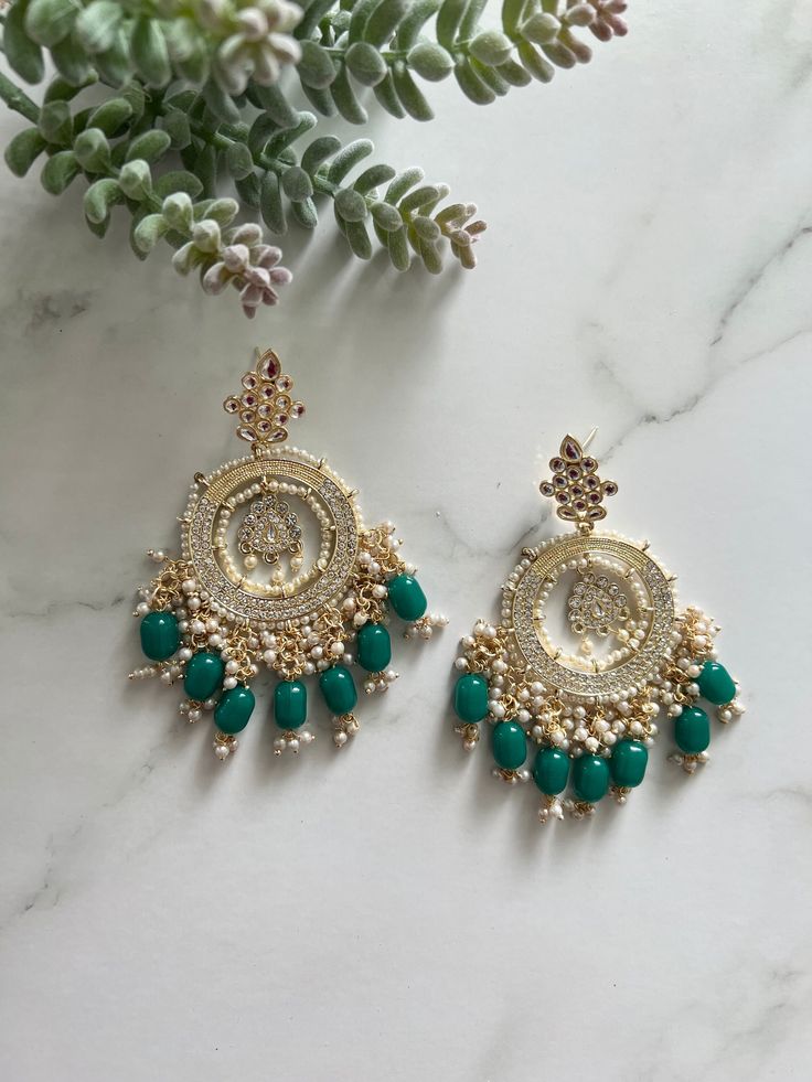 Baali chandbali earrings Stylish designer earrings Kundan, faux pearl and beads detailing Swipe through for colour selection 9cm in length Handcrafted in India Any questions please feel free to ask Green Kundan Chandbalis For Reception, Festive Chandbalis With Gota Work For Reception, Festive Gota Work Chandbalis For Reception, Eid Chandbali Bridal Earrings With Mirror Work, Eid Bridal Chandbali Earrings With Mirror Work, Festive Chandbalis With Meenakari For Reception, Diwali Reception Chandelier Earrings With Stone Work, Bollywood Chandbalis With Mirror Work For Eid, Bollywood Style Chandbalis With Mirror Work For Eid