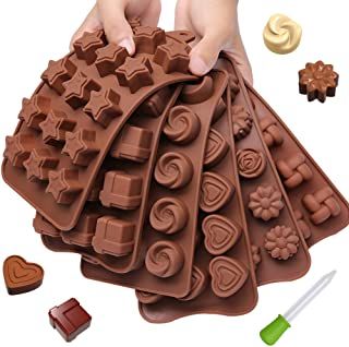 chocolate molds are arranged on top of each other to make an intricately shaped design