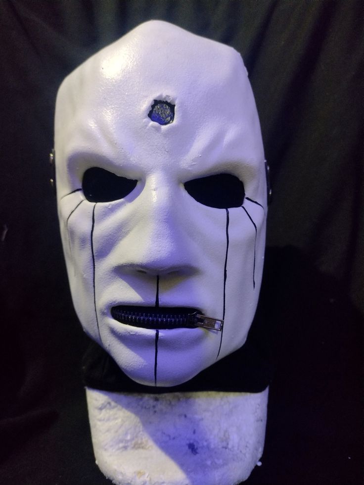 a white mask with black lines on it