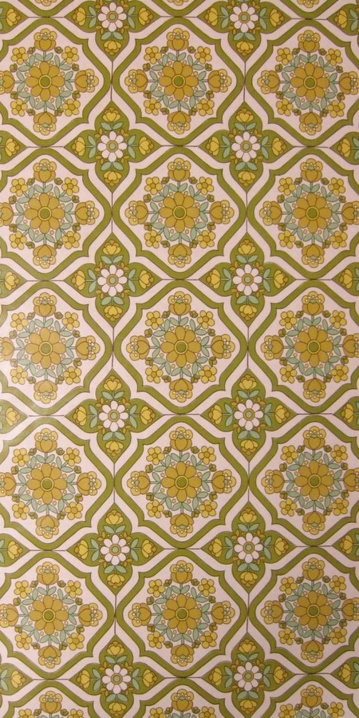 a green and white wallpaper with flowers on it